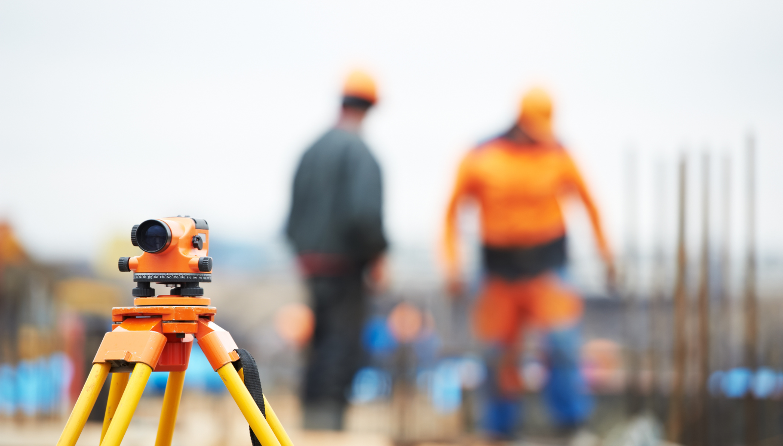 Survey team performing stockpile measurement with drones at an aggregate site for accurate inventory reporting.